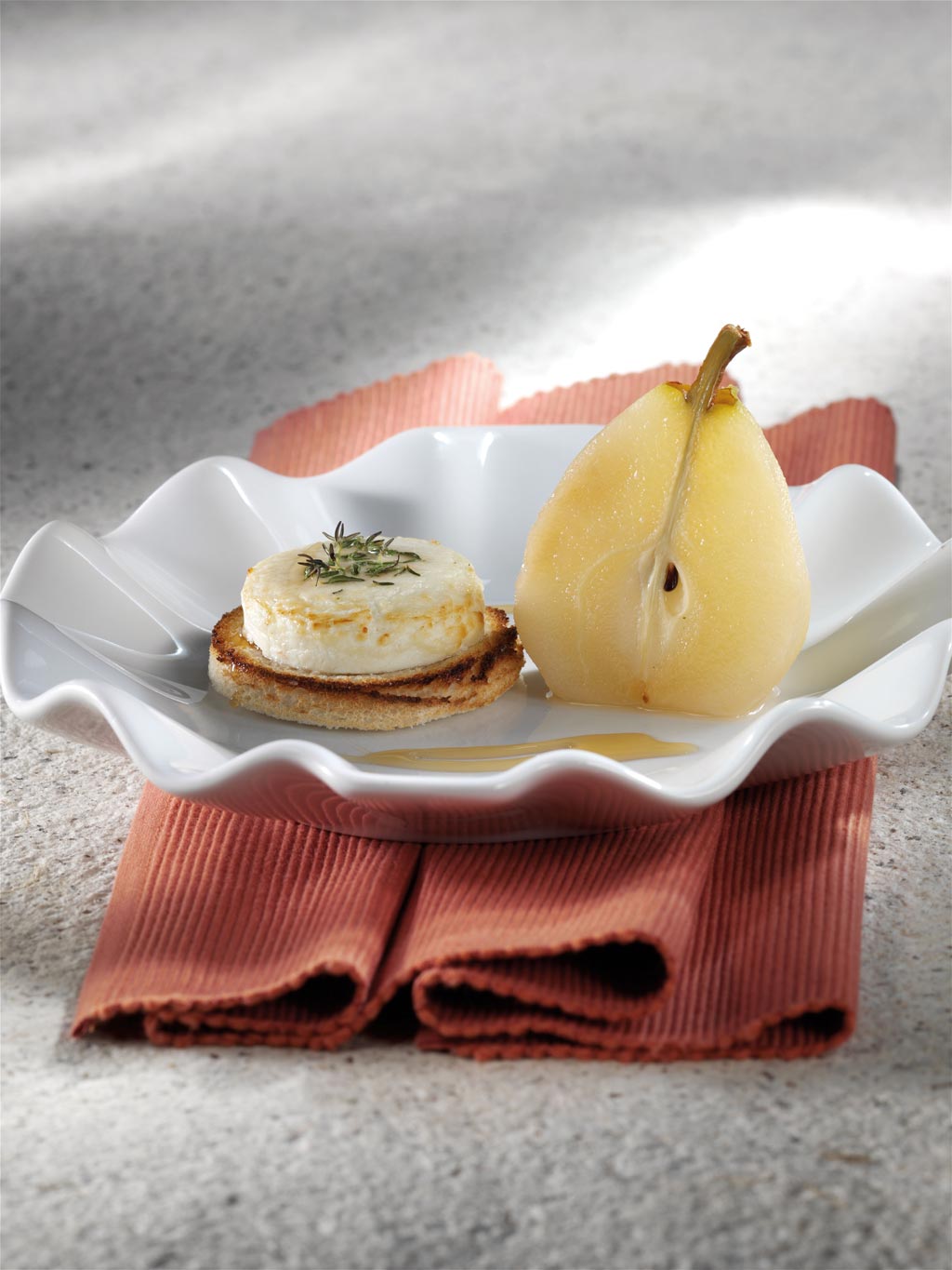Grilled goat’s cheese with pears poached in Lindemans Faro